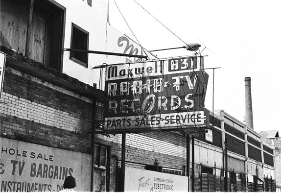 Battered main sign at 831 Maxwell Street, 1975